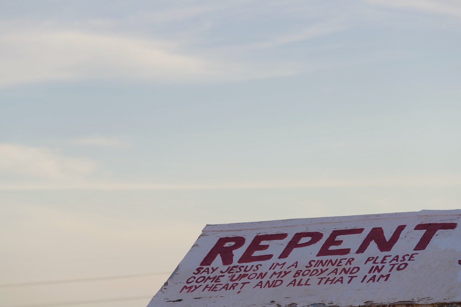 Repent signage during daytime